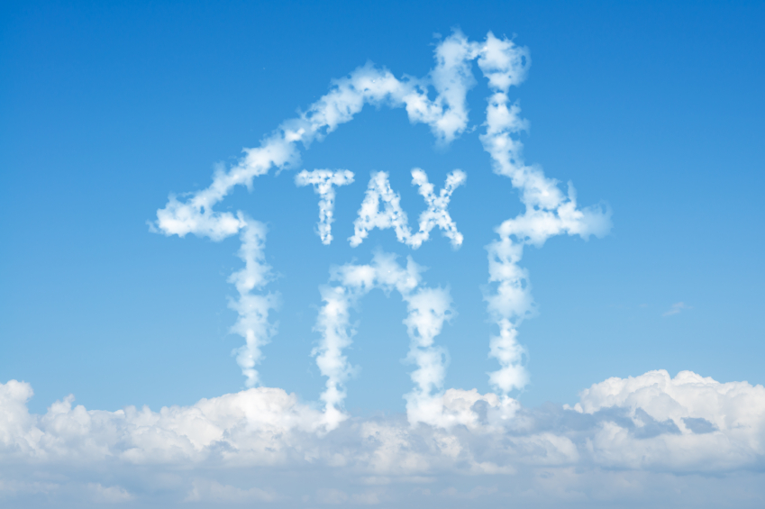 Cloud house of tax concept on blue sky